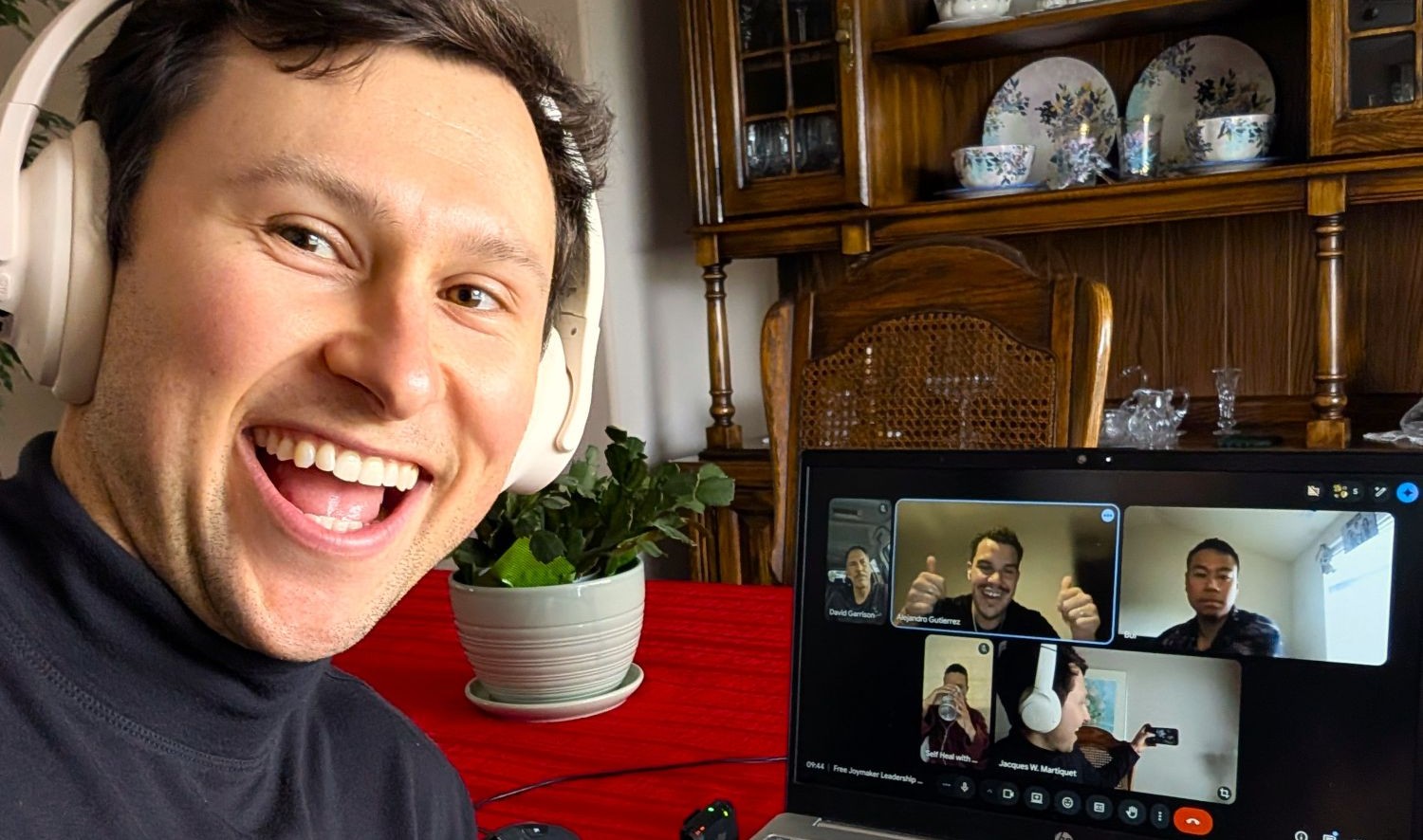 Jacques on a Joymaker video call with smiling participants