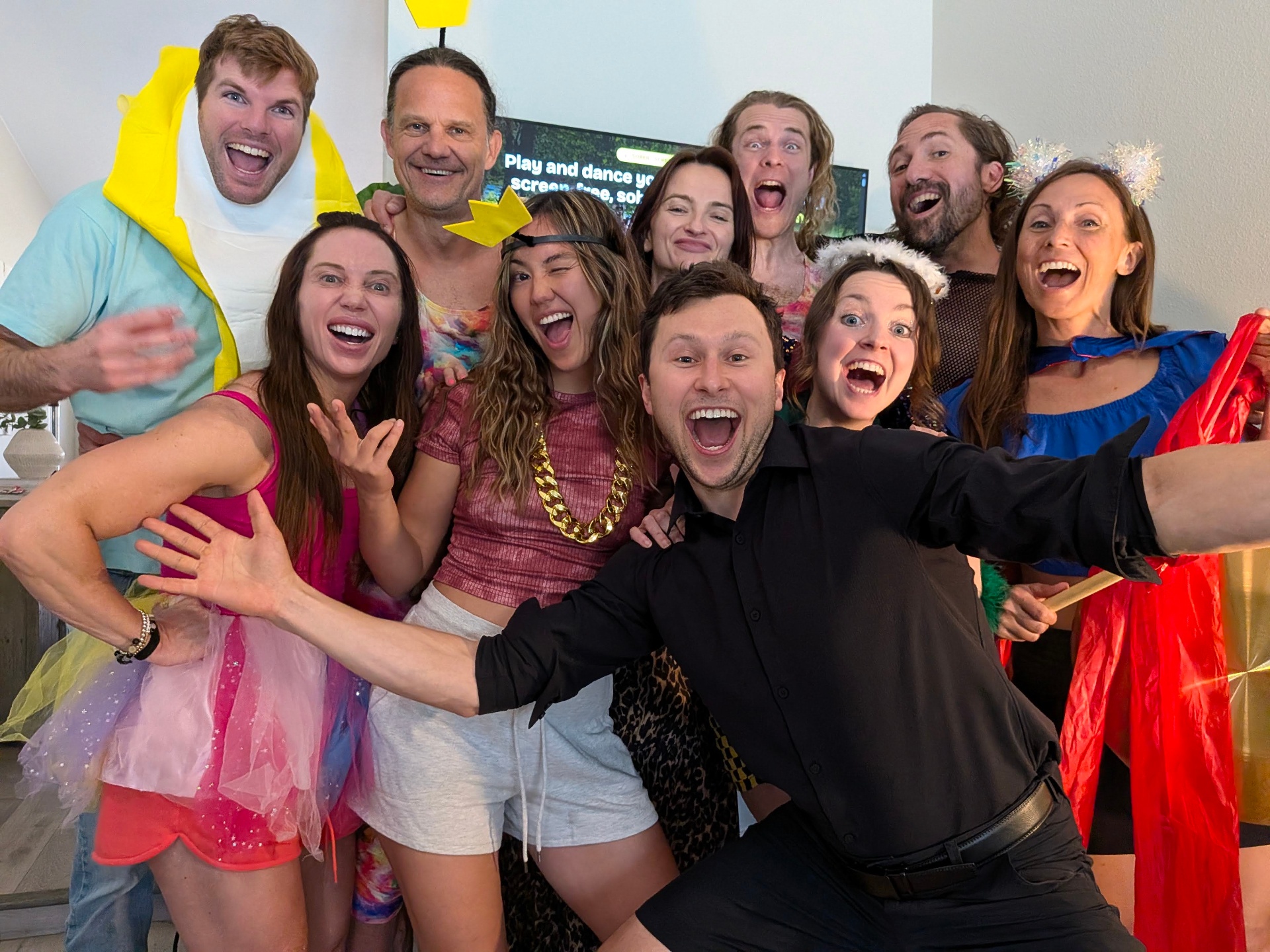 The Joymaker crew in full costume, laughing together